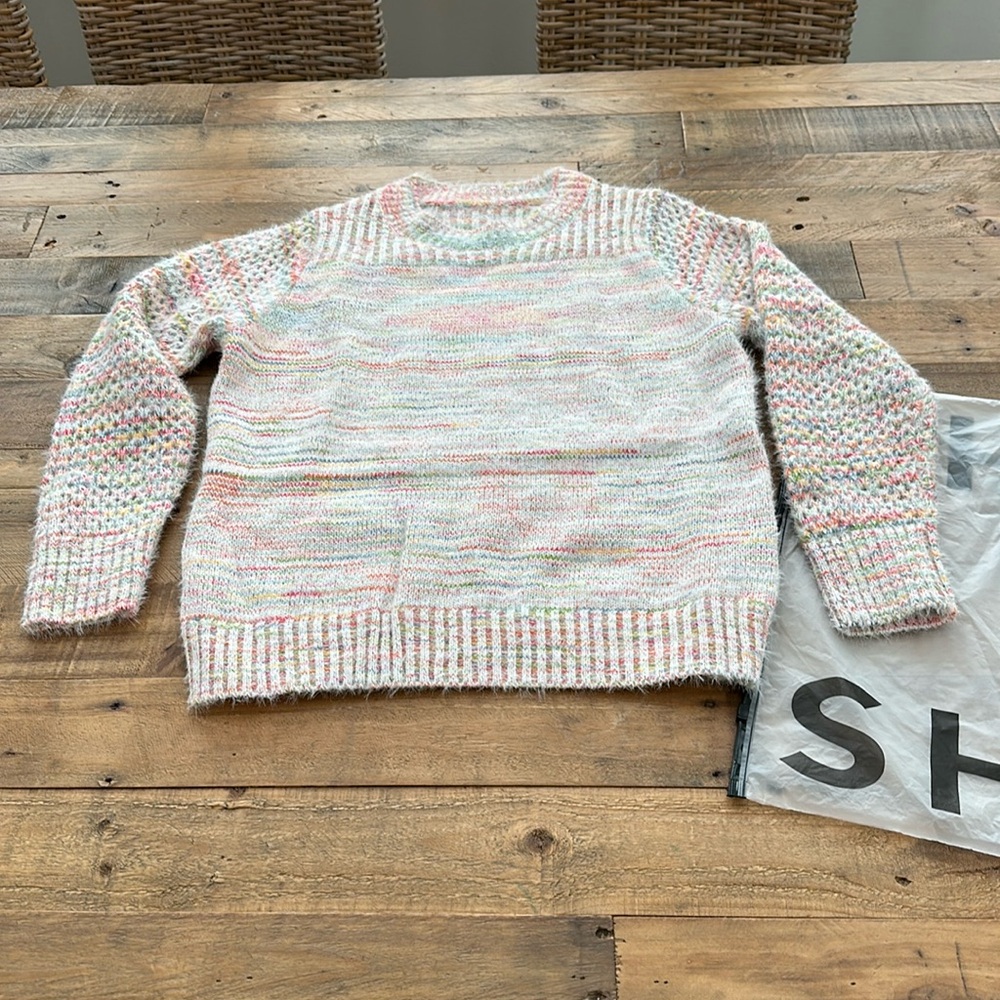 New women’s sweater unused